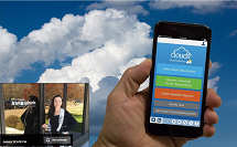 A hand holds a mobile device with a background of clouds. Inset in the lower left is a picture of a women scientist.