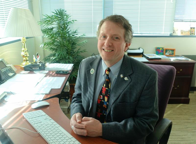 Dr. Murphy sitting at his desk