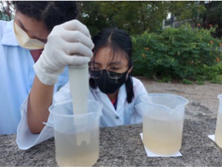 [[BHNHS Student Collecting Water Sample]]